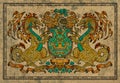Antique tapestry with golden dragons on fabric texture background