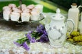 Antique tea cup on the table with pink cupcake background Royalty Free Stock Photo
