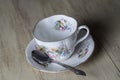 Antique Teacup and spoon on Wood Background Royalty Free Stock Photo