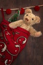 Antique teddy bear in stocking Royalty Free Stock Photo