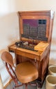 Antique telephone switchboard with chair Royalty Free Stock Photo