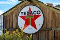 Antique Texaco sign on a wooden building