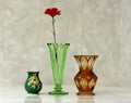 Three vases. Antique nineteenth century glass green vase and porcelain and brown glass vase.