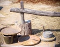 Antique thai traditional wood mortar and pestle for pounding paddy rice