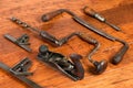 Antique tools in arrangement on wood background Royalty Free Stock Photo