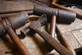 Antique tools. Hammers with wood pieces.