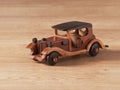 An antique toy car made of wood