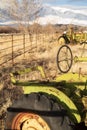 Antique tractor farm equipment in field with snowy mountains Royalty Free Stock Photo