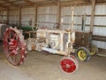 Antique tractors in an old barn Royalty Free Stock Photo