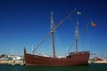 An antique traditional portuguese wooden sail boat anchored at a harbor Royalty Free Stock Photo