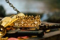 Antique treasure gold crown with coins for wealth , luxury and success concept