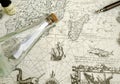 Antique treasure map and manuscript pen