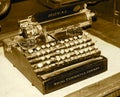 Antique Typewriter On Desk In Sepia Tone Royalty Free Stock Photo