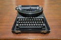 Antique typewriter on a wood table Royalty Free Stock Photo