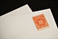 Antique United States Postal Service stamp on blank white envelope