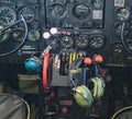 Antique US air force military plane cockpit with headphones and controls, dials, levers for flight during wartime. Royalty Free Stock Photo