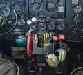 Antique US air force military plane cockpit with headphones and controls, dials, levers for flight during wartime. Royalty Free Stock Photo