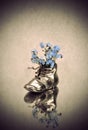 Antique vase with blue flowers Royalty Free Stock Photo