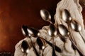 Antique, vinage cuterly spoons on silver tray with napkin Royalty Free Stock Photo