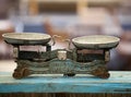 Antique vintage balance old scales on a wooden surface Royalty Free Stock Photo