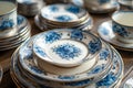 Antique Vintage Blue and White Porcelain Plates and Bowls Stacked on Wooden Table Royalty Free Stock Photo