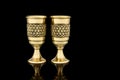 Antique Vintage Brass Shot Glass Gilded on Black background