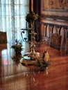 Antique vintage candelabra on a polished wood table at the Larnach castle in New Zealand