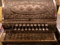 Antique vintage fully metal cash register on the wooden table