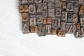 Antique vintage movable type alphabet set on white wooden deck