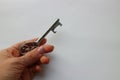 Antique vintage silver shiny key in hand Royalty Free Stock Photo