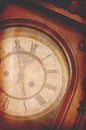 Antique vintage wall clock showing five minutes to midnight Royalty Free Stock Photo