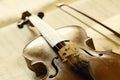 Antique violin with fiddlestick