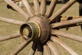 Antique wagon wheel made of wood and bronze Royalty Free Stock Photo