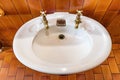 Antique washbasin with bronze taps