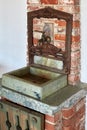 Antique washstand with bronze faucet Royalty Free Stock Photo