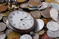 Antique watch and coins Royalty Free Stock Photo