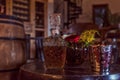 Antique whiskey bottle on top of classic table with candles and roses. Royalty Free Stock Photo