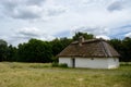 Antique white clay house with hay roof in Pirogovo park, Kiev Royalty Free Stock Photo