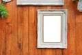 Antique white photo frame with empty space for your picture or text placed on wood plank wall background Royalty Free Stock Photo