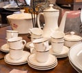 Antique white and yellow porcelain coffee set with gold ornaments Royalty Free Stock Photo