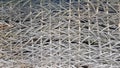 Antique wicker wall or fence close up. Texture, background. Wicker grape fence