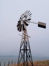 Antique wind mill by the sea Royalty Free Stock Photo