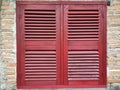 antique window made of wood with two red doors Royalty Free Stock Photo