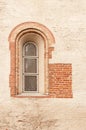 The antique window in stone wall Royalty Free Stock Photo