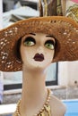 Antique woman mannequin. Head with fashion hat