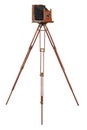An antique wood camera on an old wooden tripod isolated on white Royalty Free Stock Photo