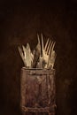 Antique wooden barrel with forks, knives and spoons