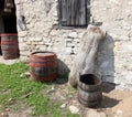 Antique wooden barrels with and wooden trough Royalty Free Stock Photo