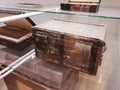 Antique wooden boxes on the rack.