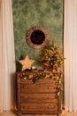 Antique wooden brown chest of drawers with Christmas decor Royalty Free Stock Photo